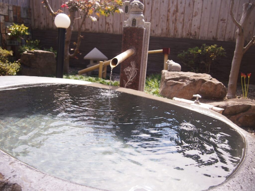 庭園露天風呂の湯口